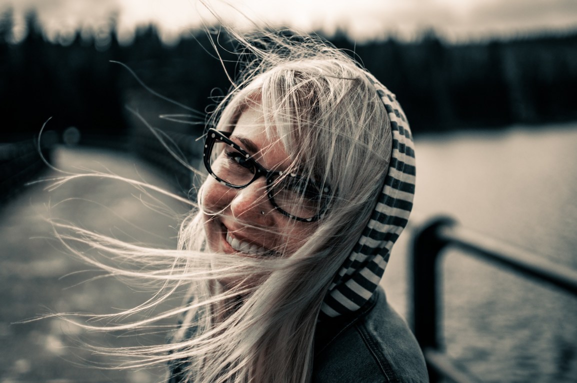 girl with glasses smiling